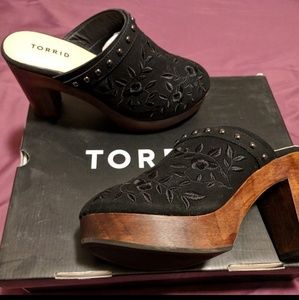 Wooden bottom, heeled clogs